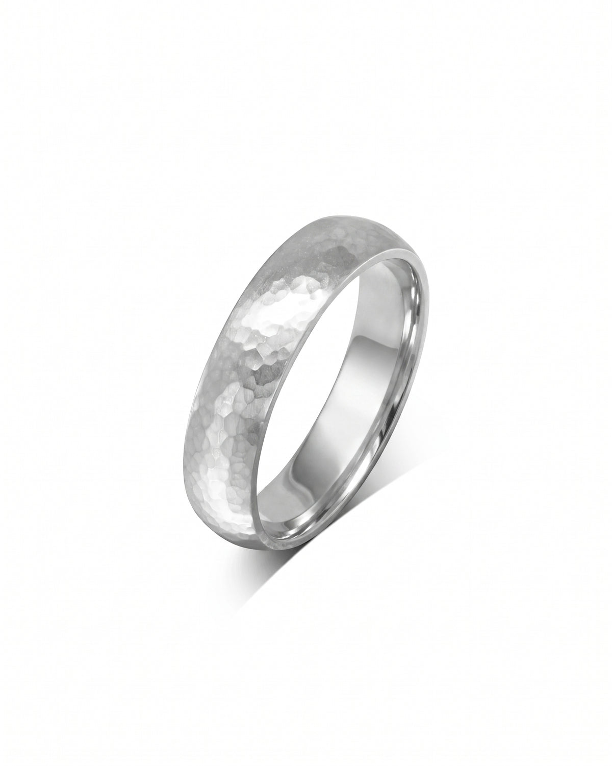 Silver-toned metal wedding ring with a matte hammered texture and a smooth, polished inner band.