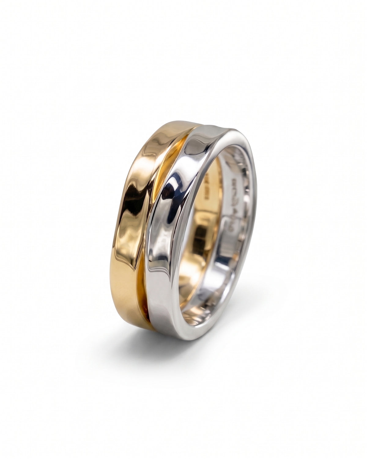 Men's ring featuring a polished gold and silver mixed metal band with a subtle hammered side texture.