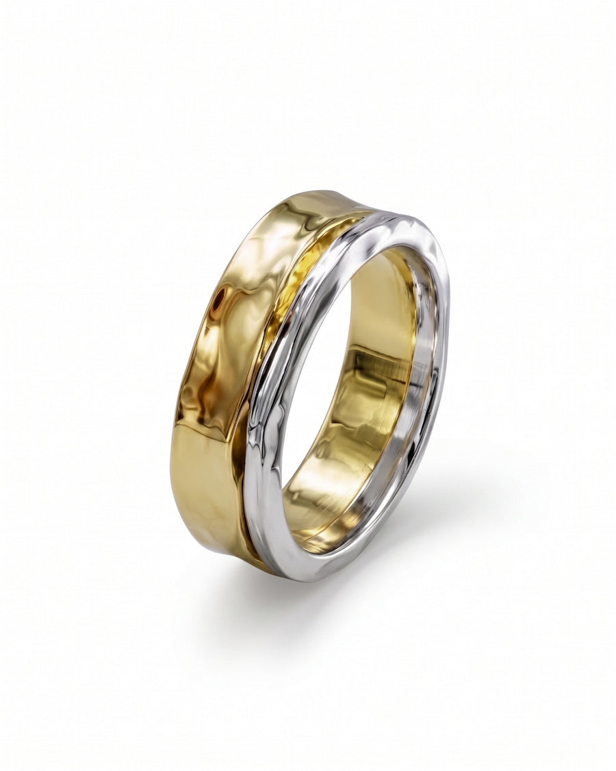 Two-tone wedding ring featuring a hammered yellow gold band layered over a polished white metal band.