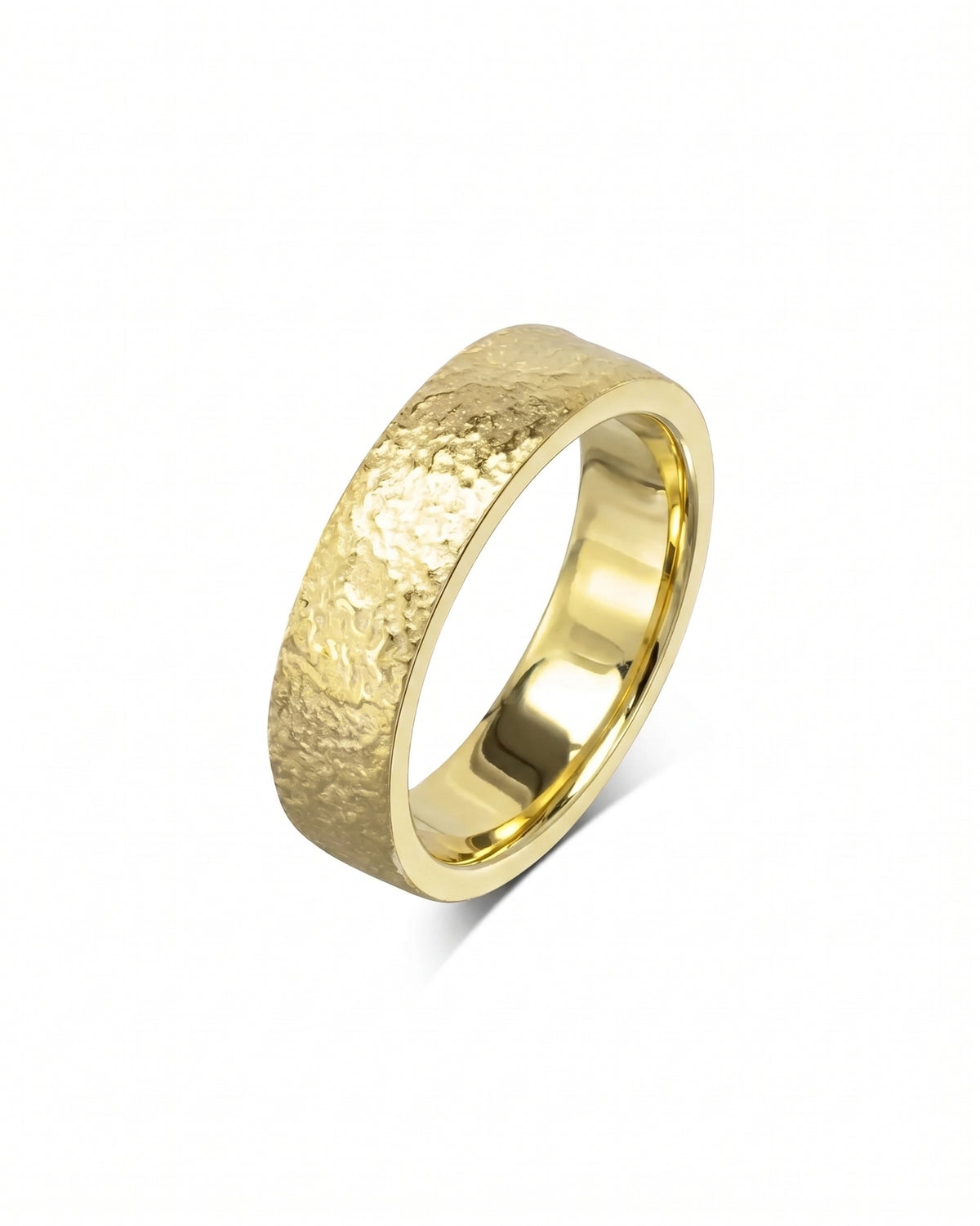 Gold wedding band with a textured, hammered finish and a smooth, polished interior surface.