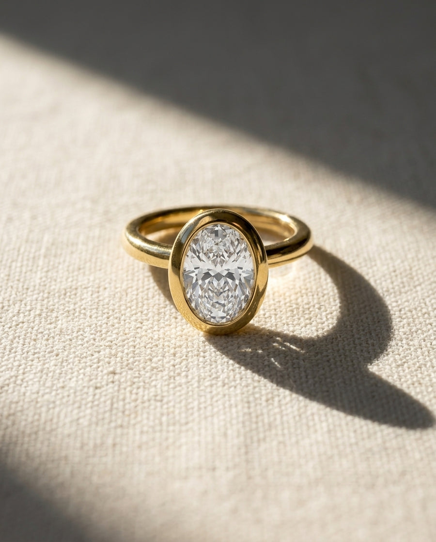 Oval Cut Bezel Cathedral Engagement Ring