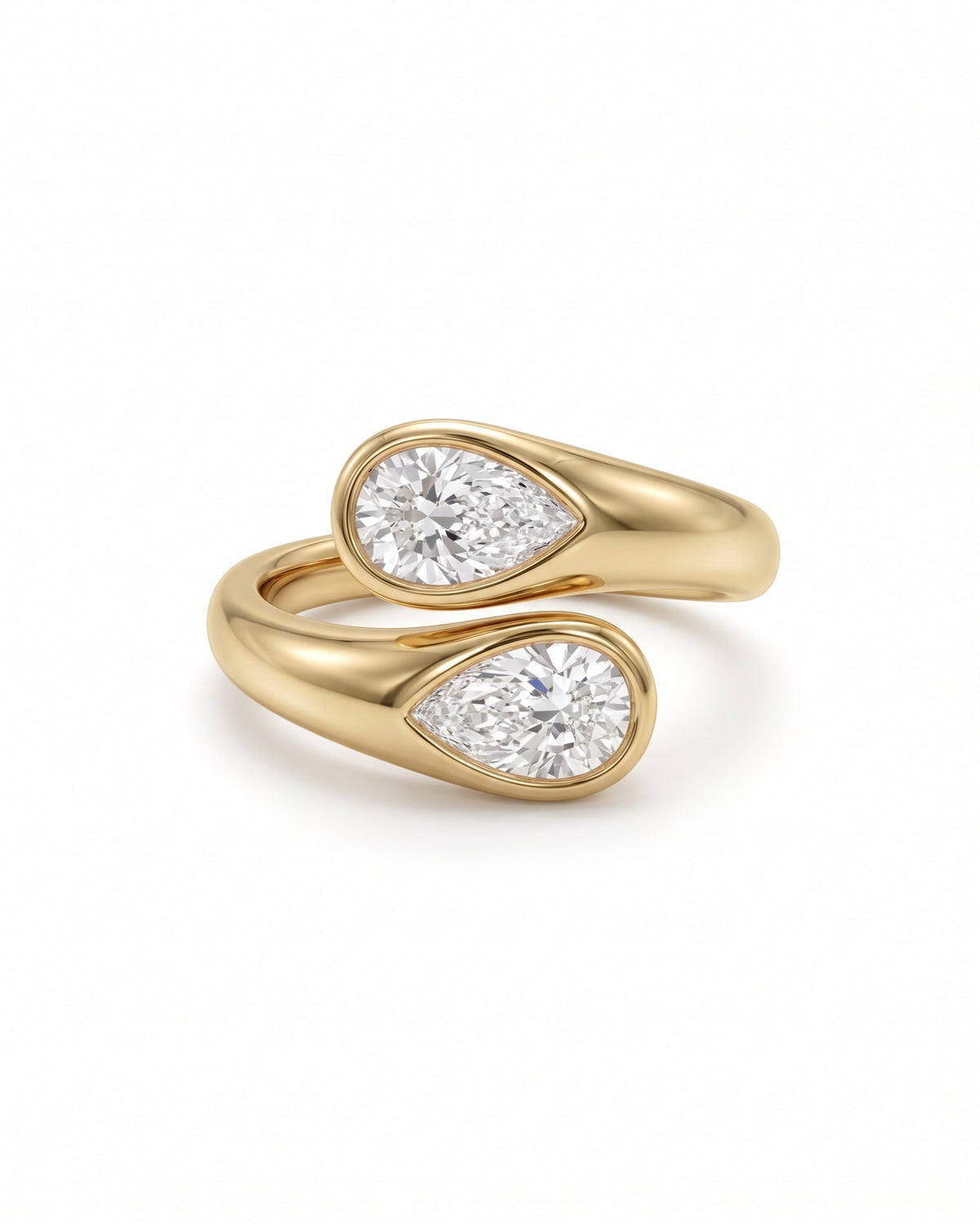 Gold toi et moi engagement ring featuring two pear-cut diamonds in bezel settings.