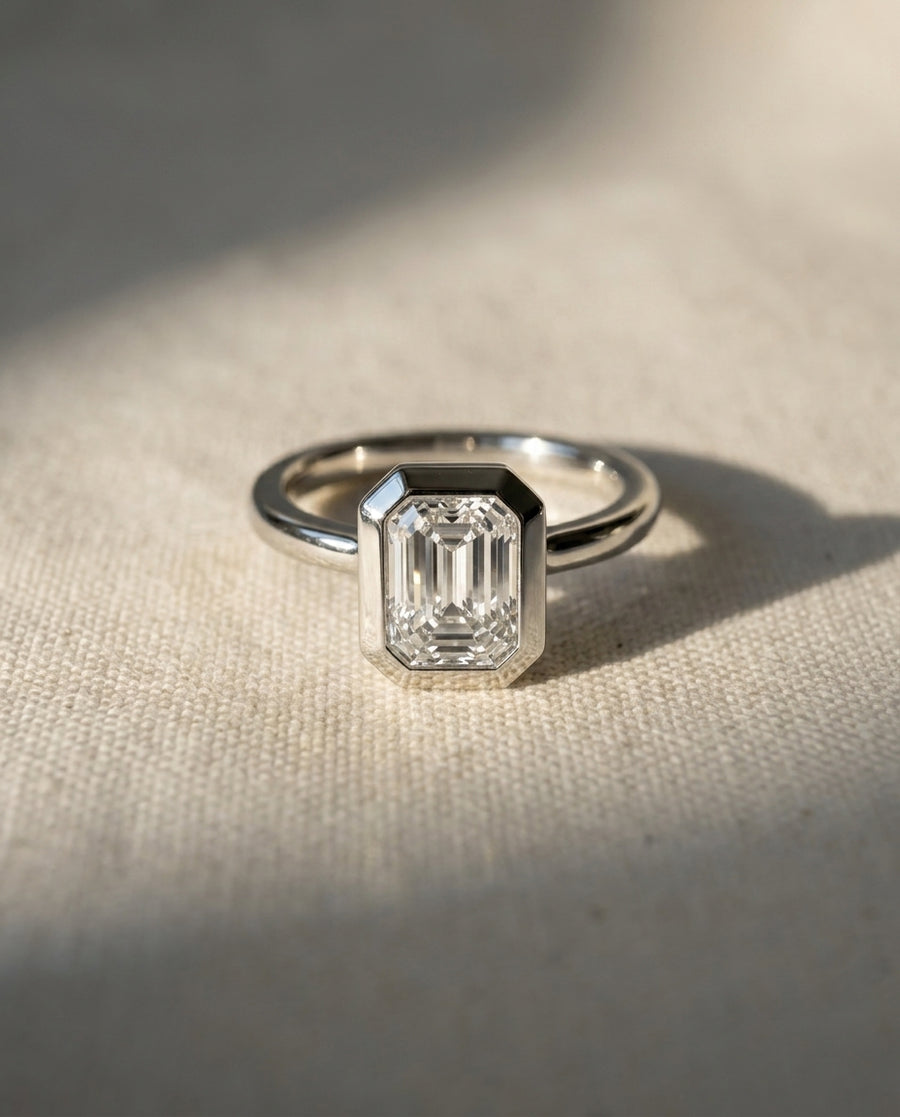 Emerald Cut Bezel Cathedral Engagement Ring