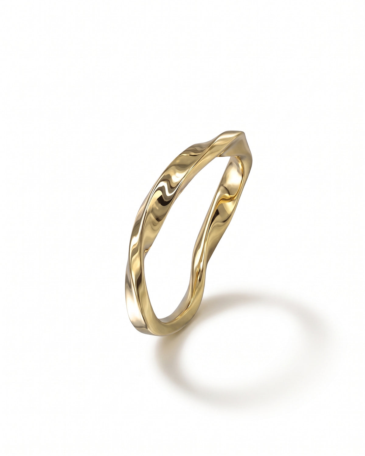 Polished yellow gold ring featuring a continuous, irregular twisted band design on a white background.