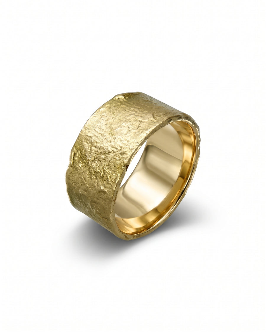Wide yellow gold wedding band featuring a textured, reticulated outer surface and a smooth, polished interior.