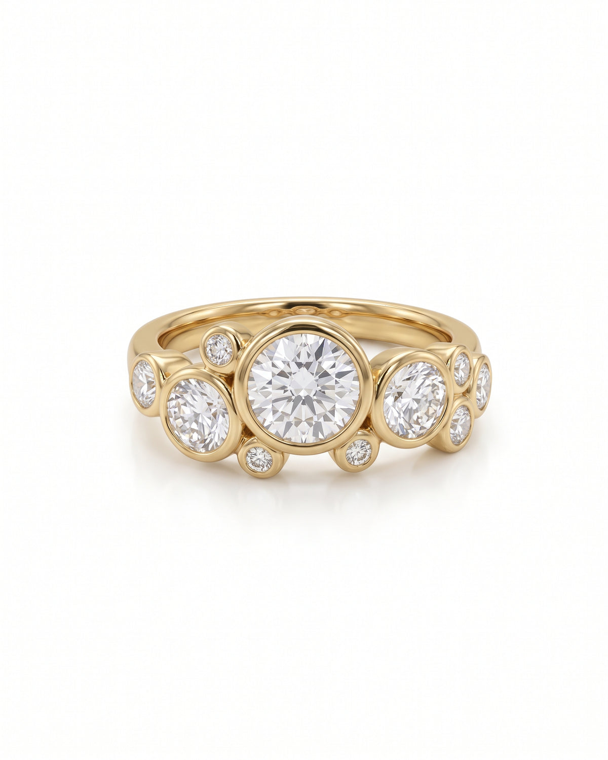 Gold engagement ring featuring multiple round cut diamonds in a bubble-style bezel setting.