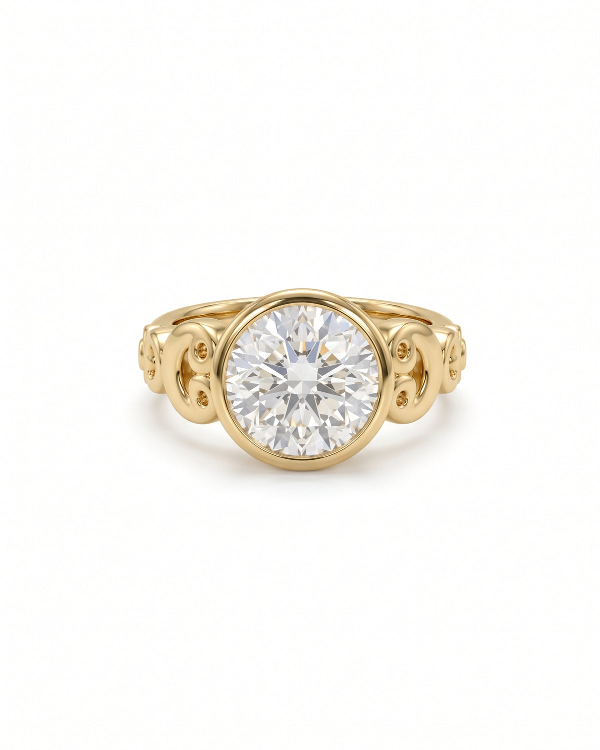 Round diamond engagement ring in a yellow gold rub over setting with ornate scrollwork details.