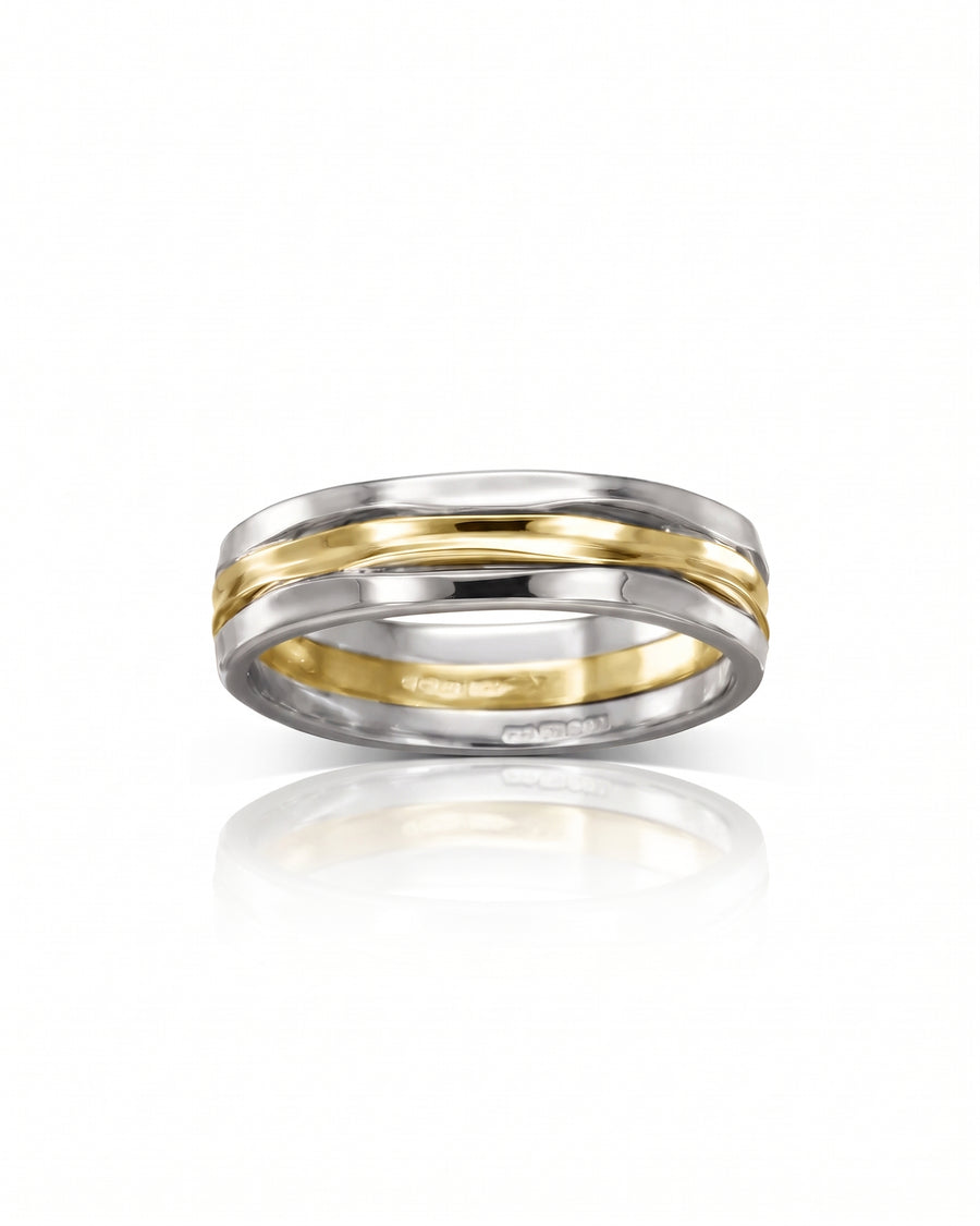 Three-strand ring in silver and gold with a hammered finish and polished center band.