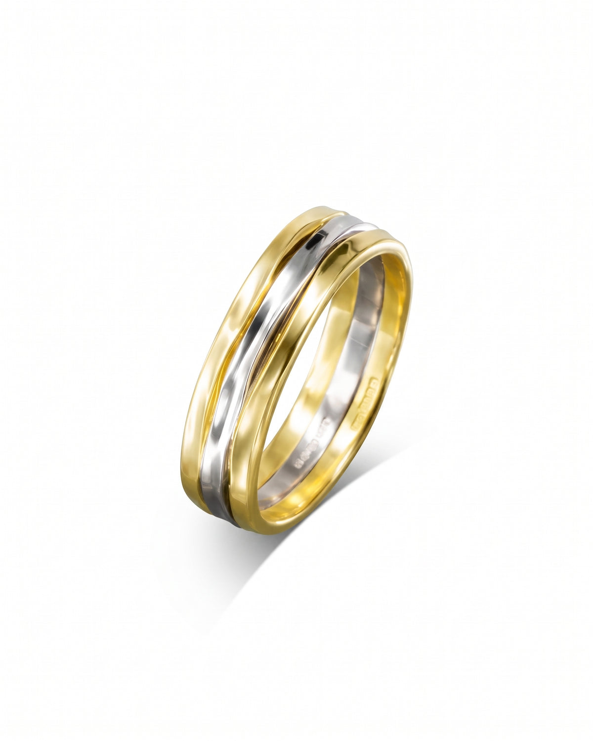 Two-tone wedding band featuring a central white gold inlay flanked by yellow gold hammered edges.