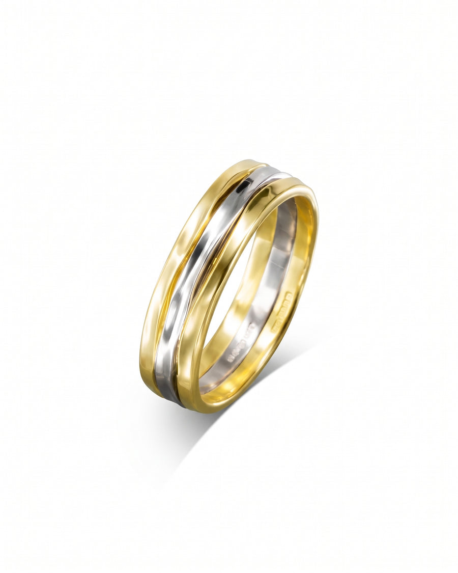 Two-tone wedding band featuring a central white gold inlay flanked by yellow gold hammered edges.