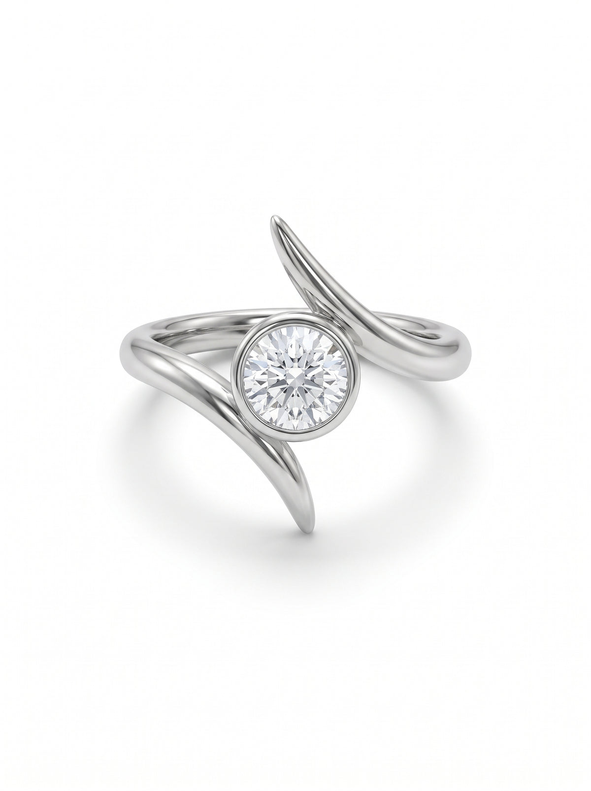 Silver engagement ring with a round bezel-set diamond and a unique crossover spiky band design.
