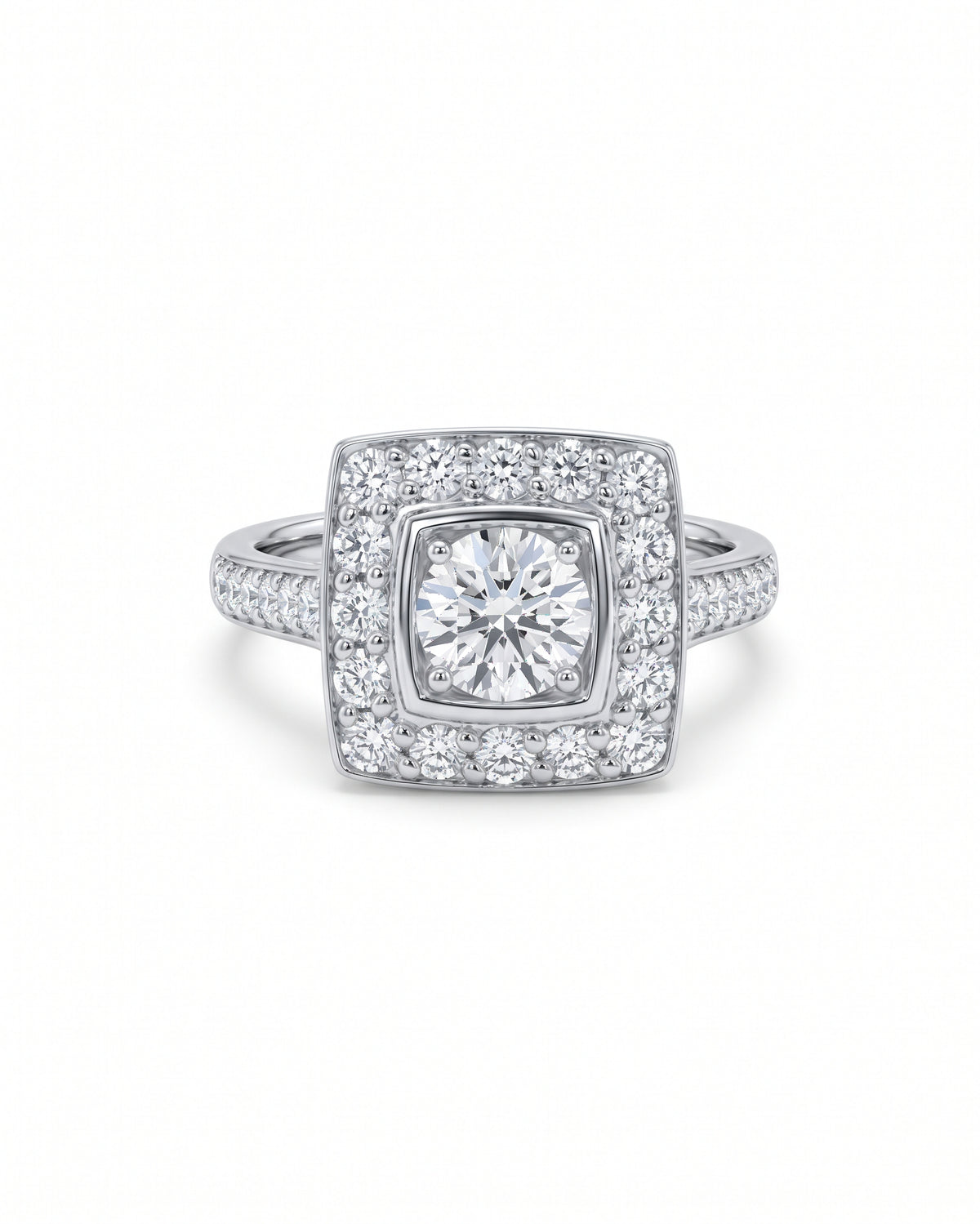 Square cluster engagement ring in white gold with a round center diamond and pavé diamond shoulders.