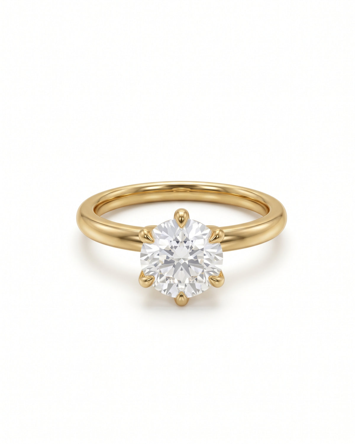Round cut solitaire diamond engagement ring set in a polished yellow gold band with six prongs.
