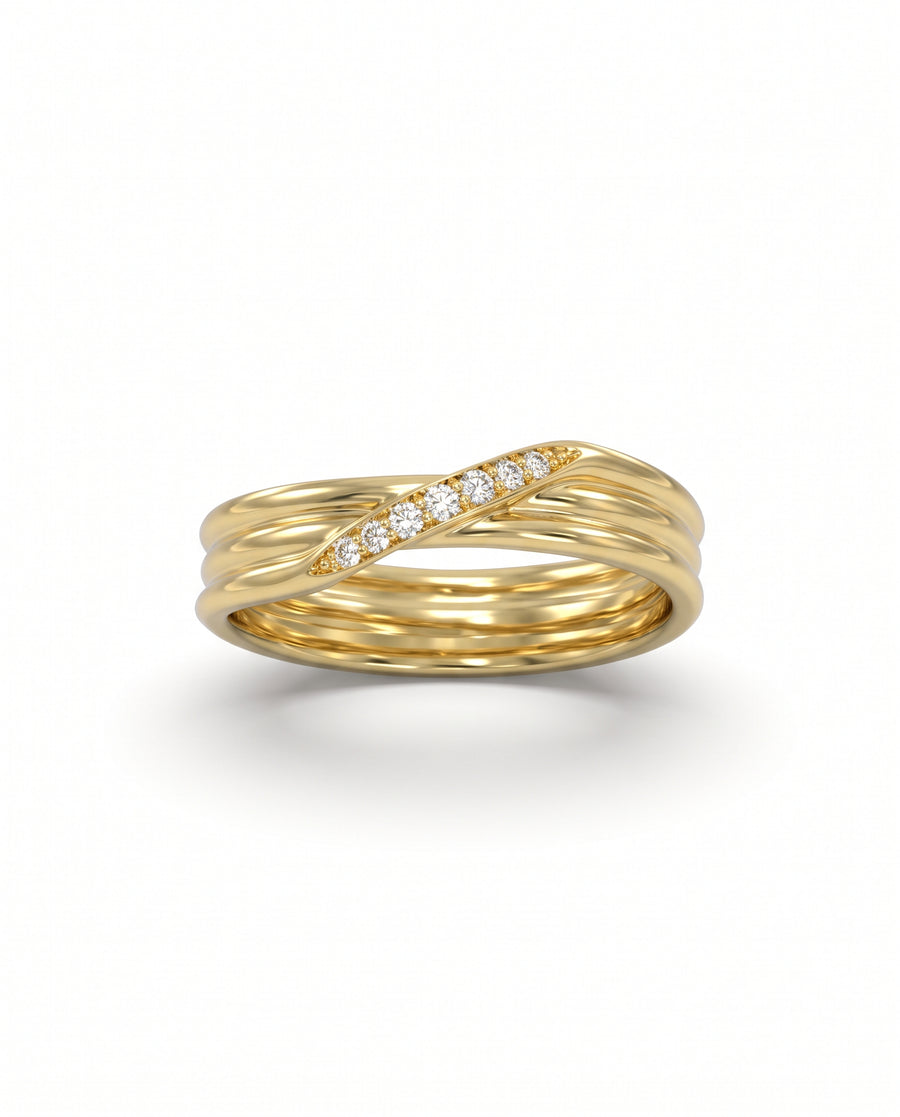 Yellow gold three-strand crossover ring featuring a diagonal row of small round diamonds.