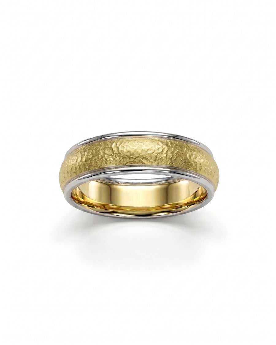 Two-tone wedding band with a hammered matte gold center and polished white gold edges.