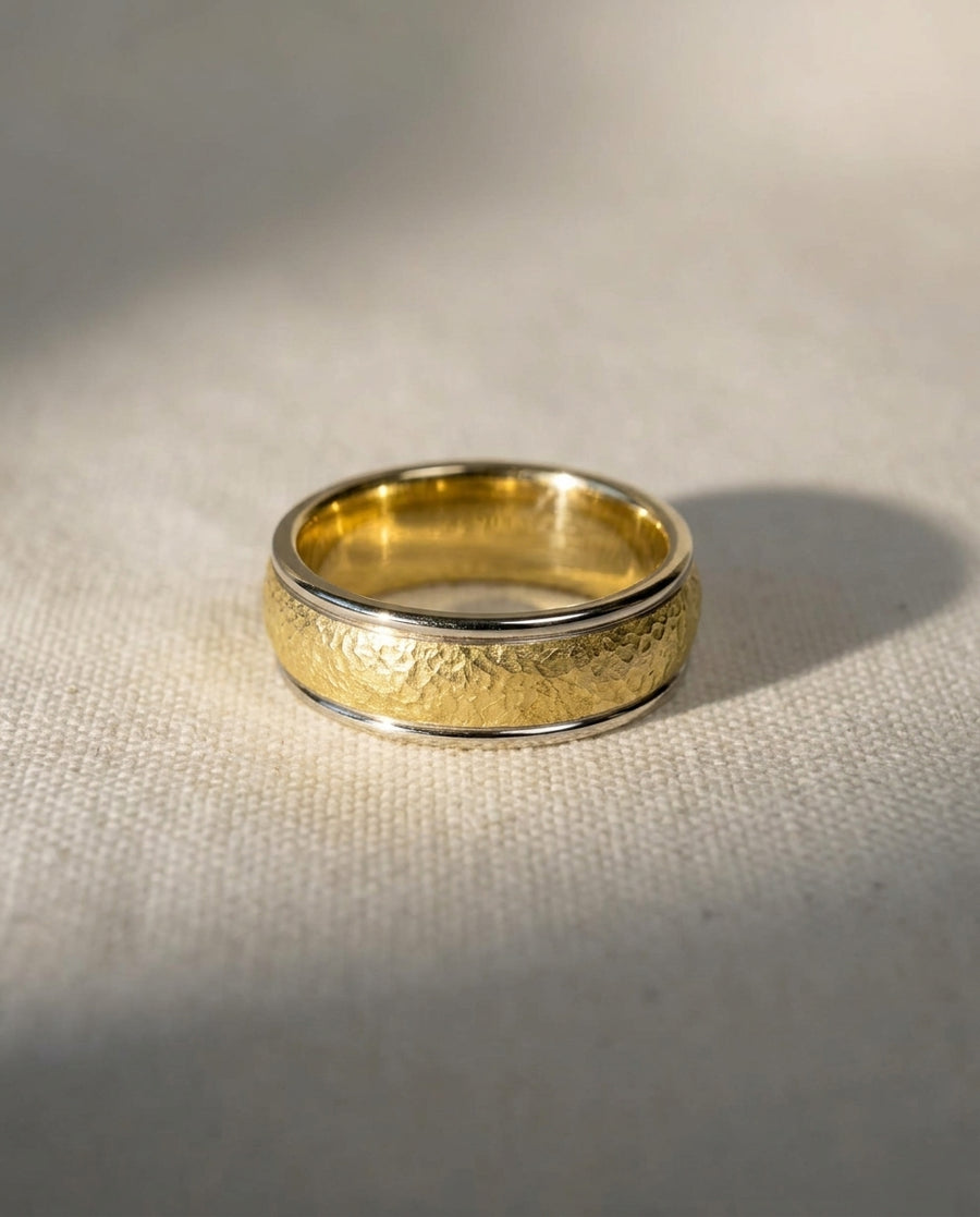 4mm wedding band in 9ct white and yellow gold with a textured matte finish and polished edges.