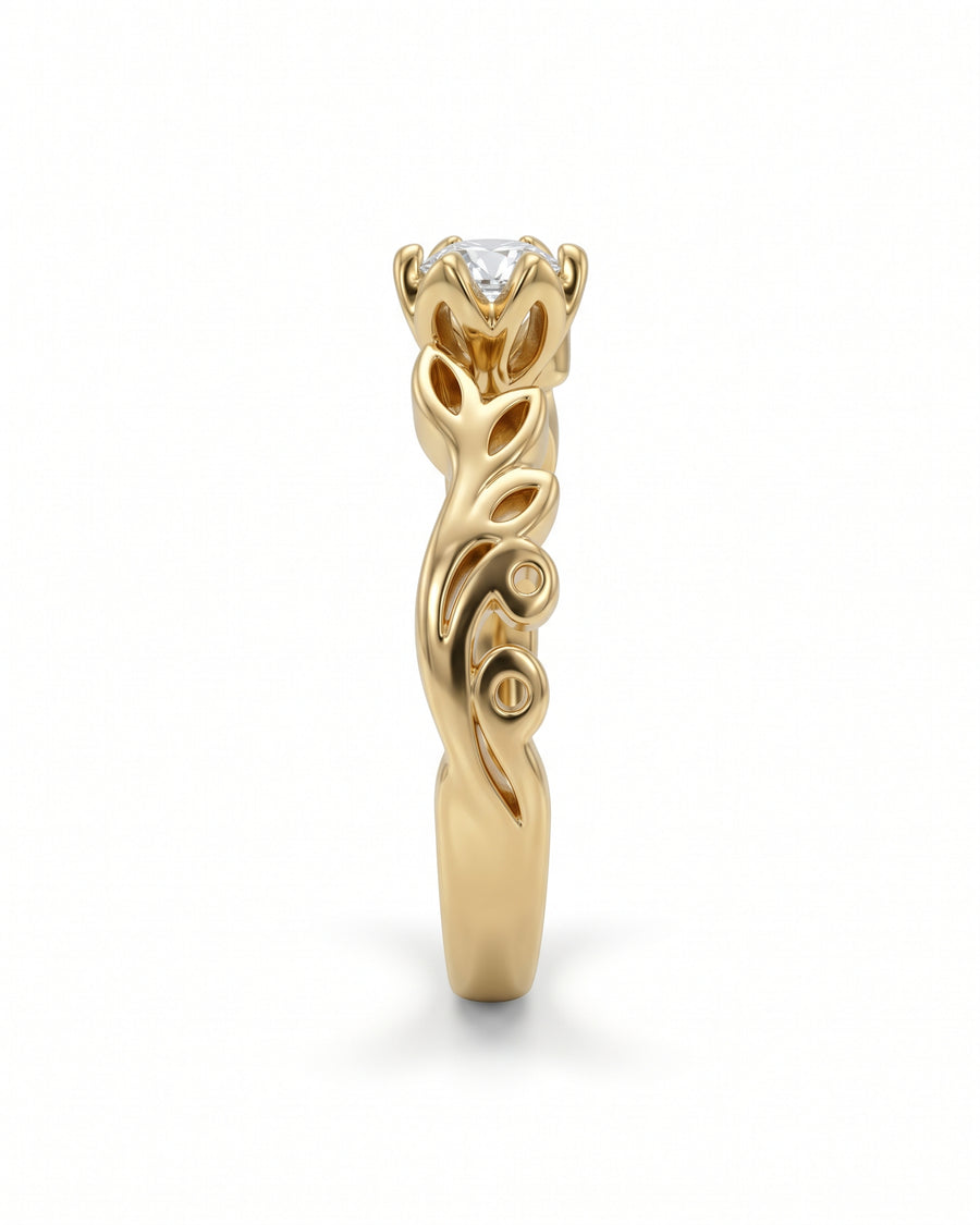 Gold engagement ring featuring a round diamond in a floral-inspired setting with intricate leaf-shaped band details.