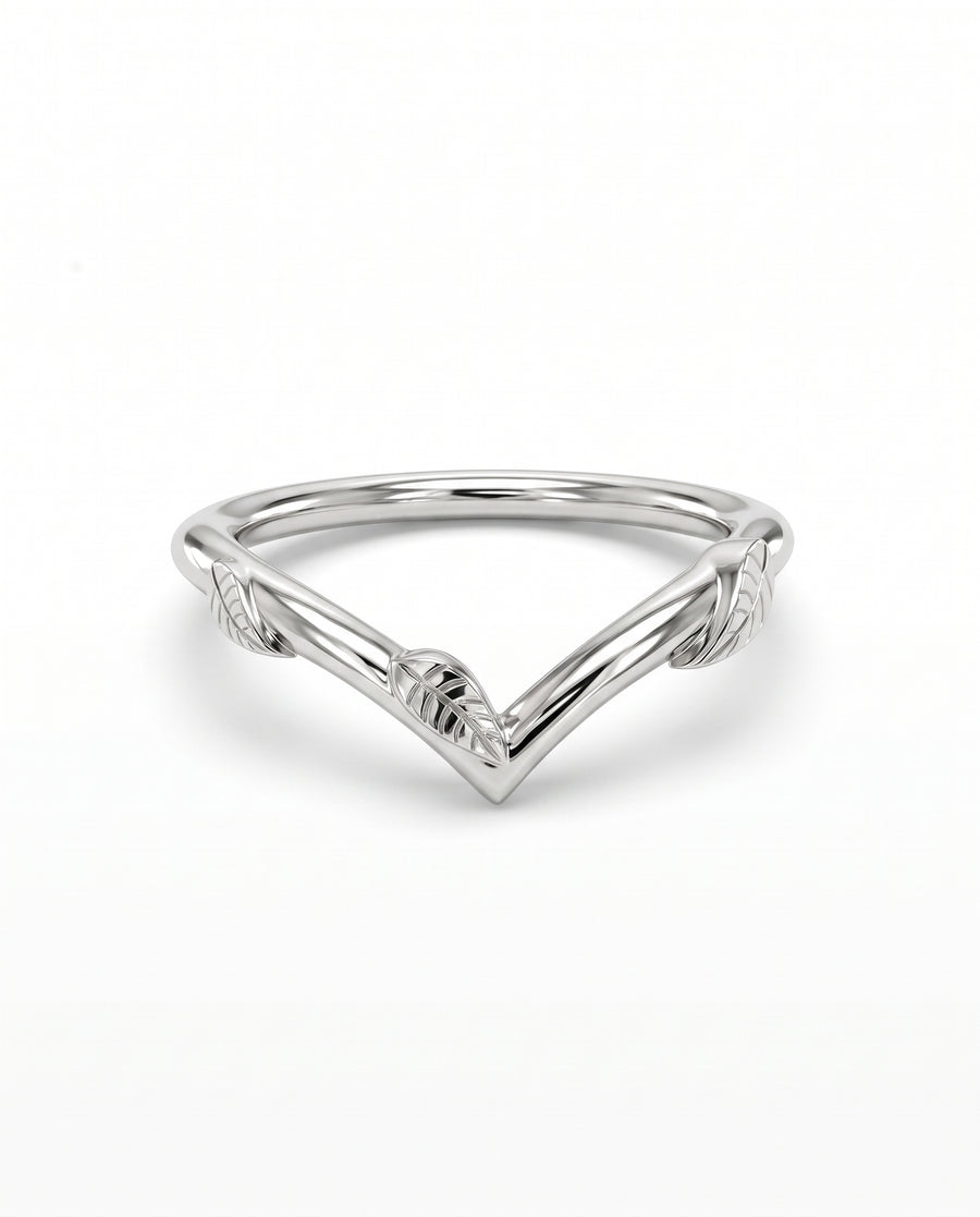 Silver wishbone wedding ring featuring engraved leaf details along the band on a white background.