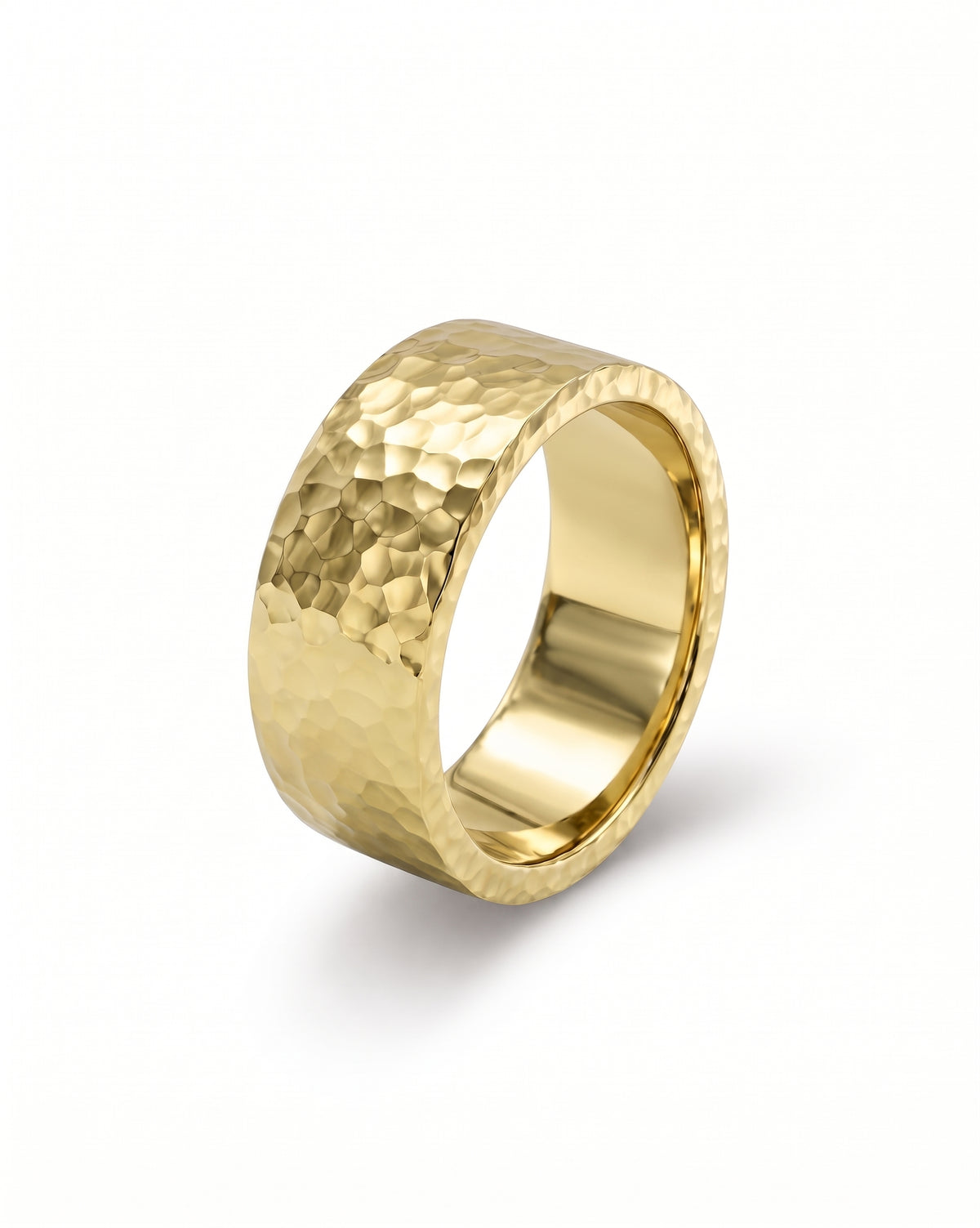 Gold flat wedding ring with a textured hammered finish and polished inner band.