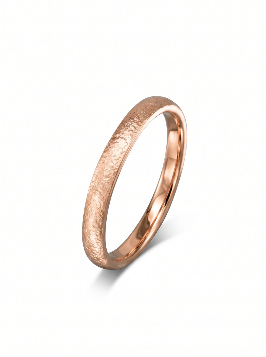 Rose gold court wedding band with a textured, hammered finish and a polished inner band.