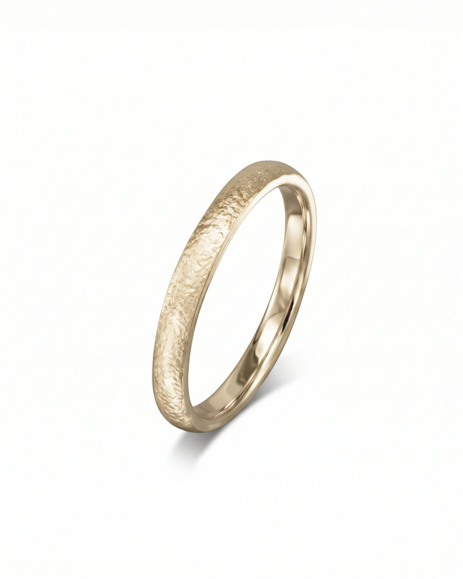 Yellow gold court wedding band with a textured, matte finish and polished inner band.