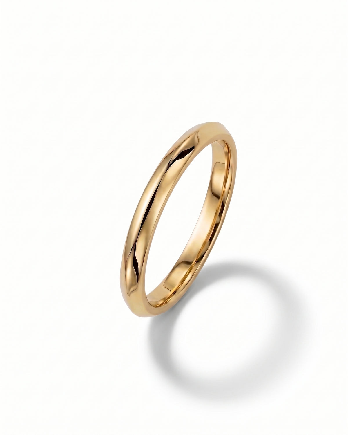 Polished yellow gold wedding band with a smooth, rounded profile on a white background.