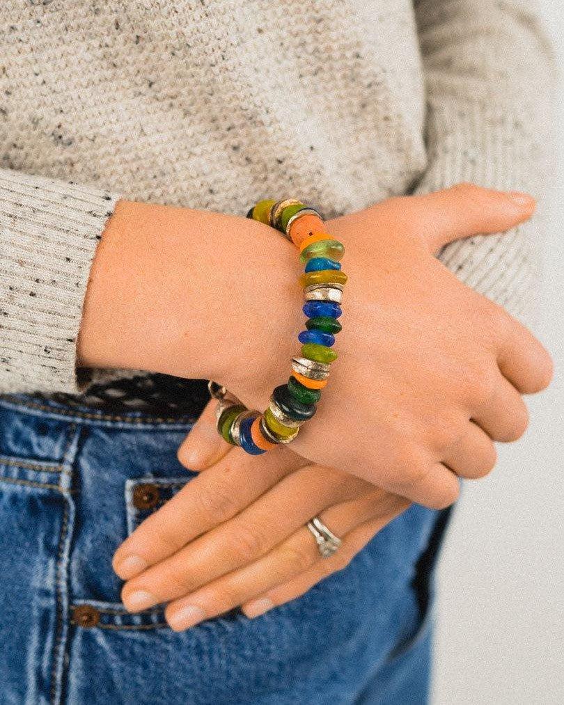 Handmade recycled glass bead bracelet with colorful, chunky beads on wrist
