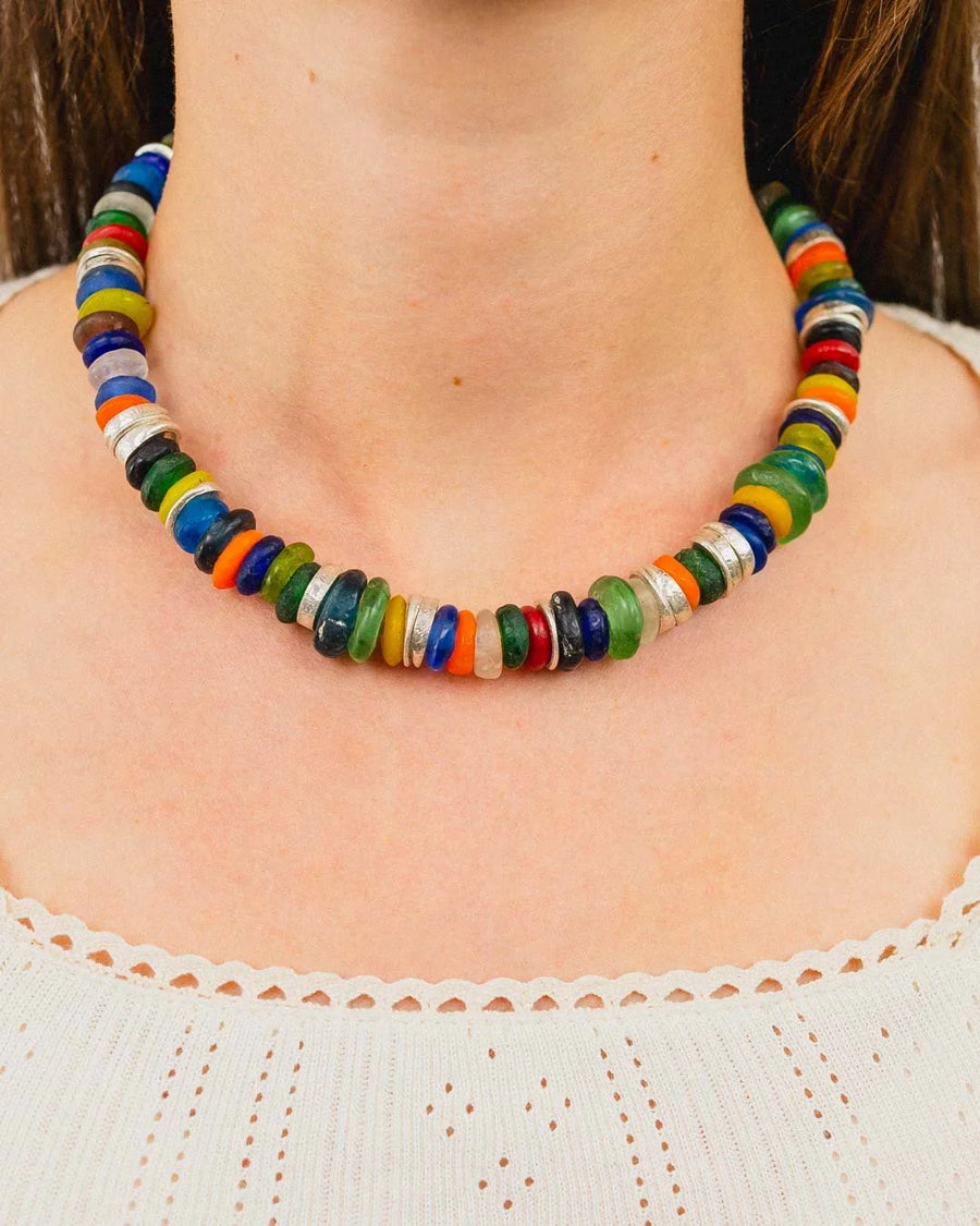 Colorful African recycled glass bead necklace with silver spacers worn on neck