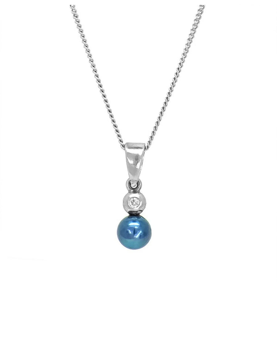 Elegant silver necklace with a blue akoya pearl and small diamond pendant on white background