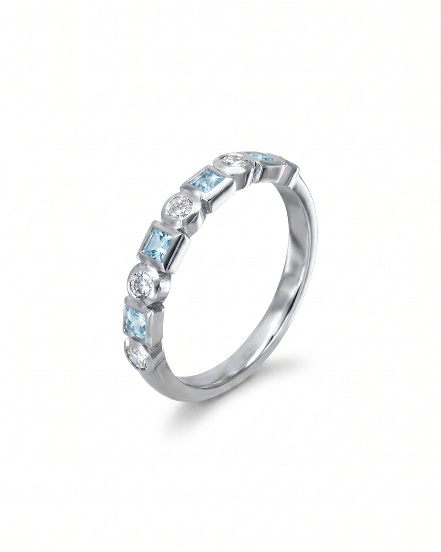 Platinum half eternity ring with alternating aquamarine and diamond gemstones.