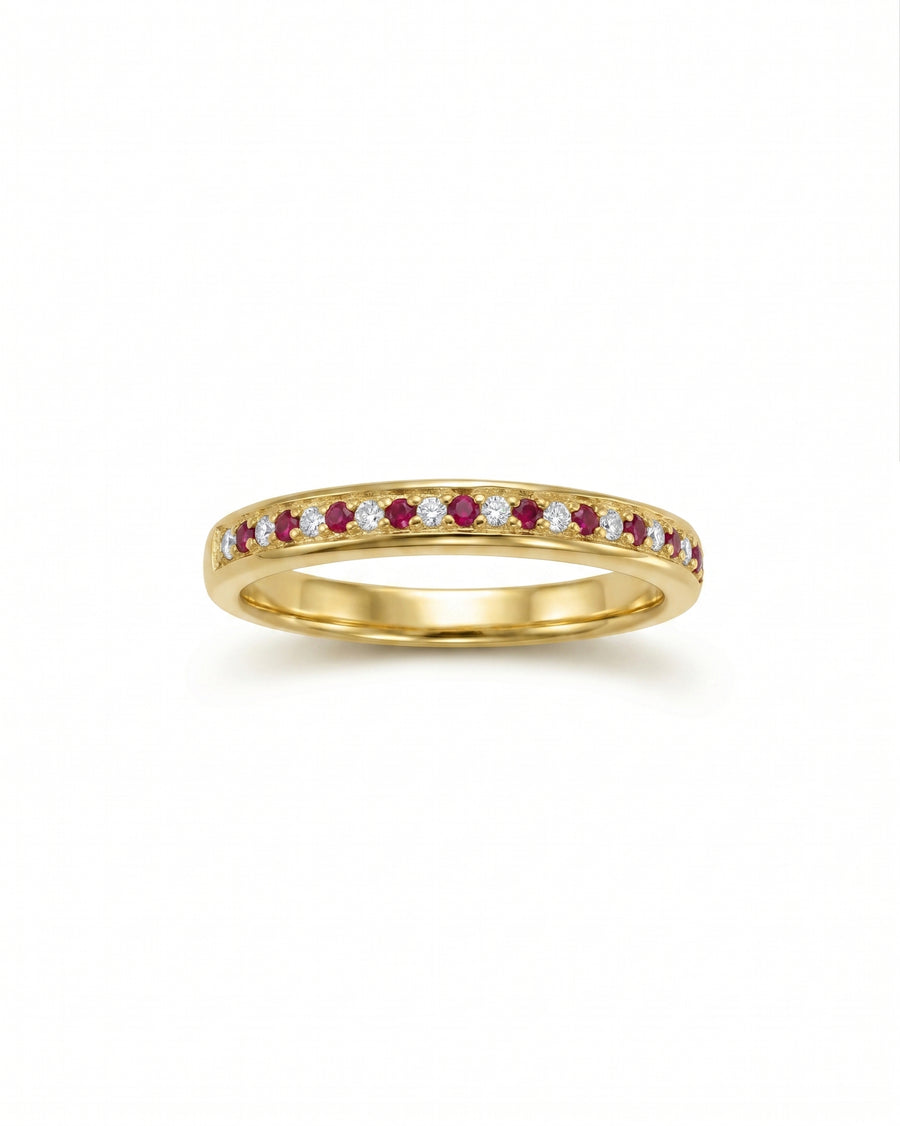 Gold eternity ring with alternating rubies and diamonds.