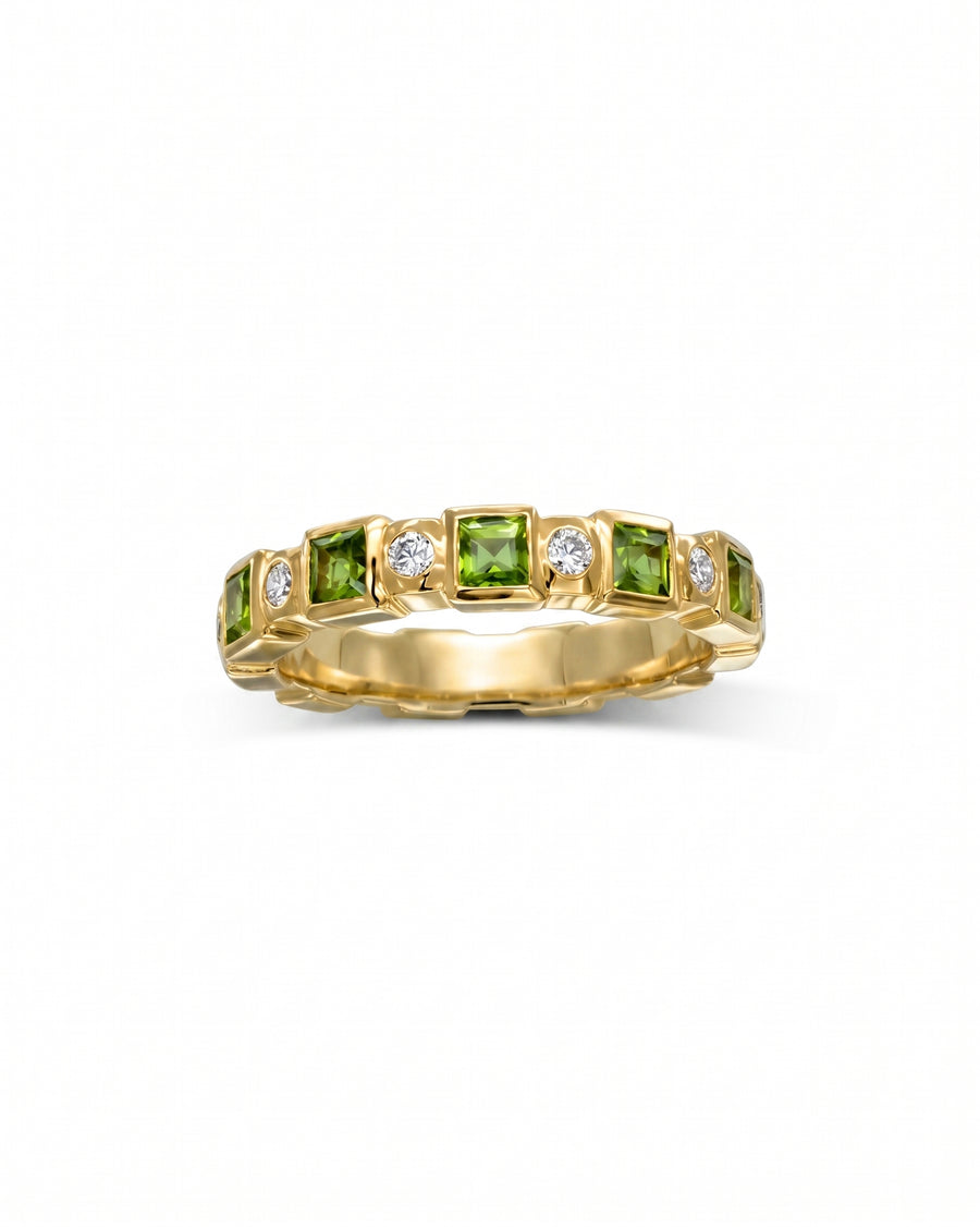 Yellow gold full eternity ring with alternating square peridot and round diamond gemstones.