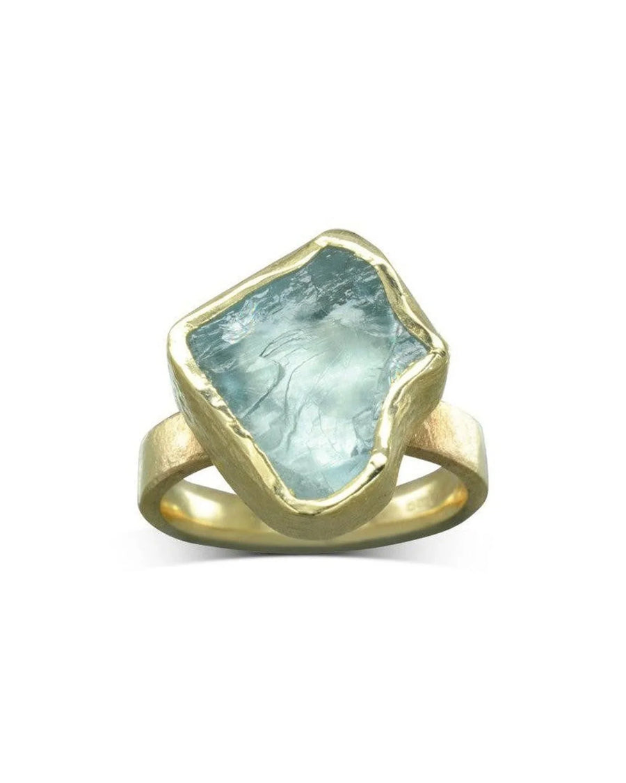 Chunky yellow gold ring with a raw aquamarine gemstone and organic textured finish
