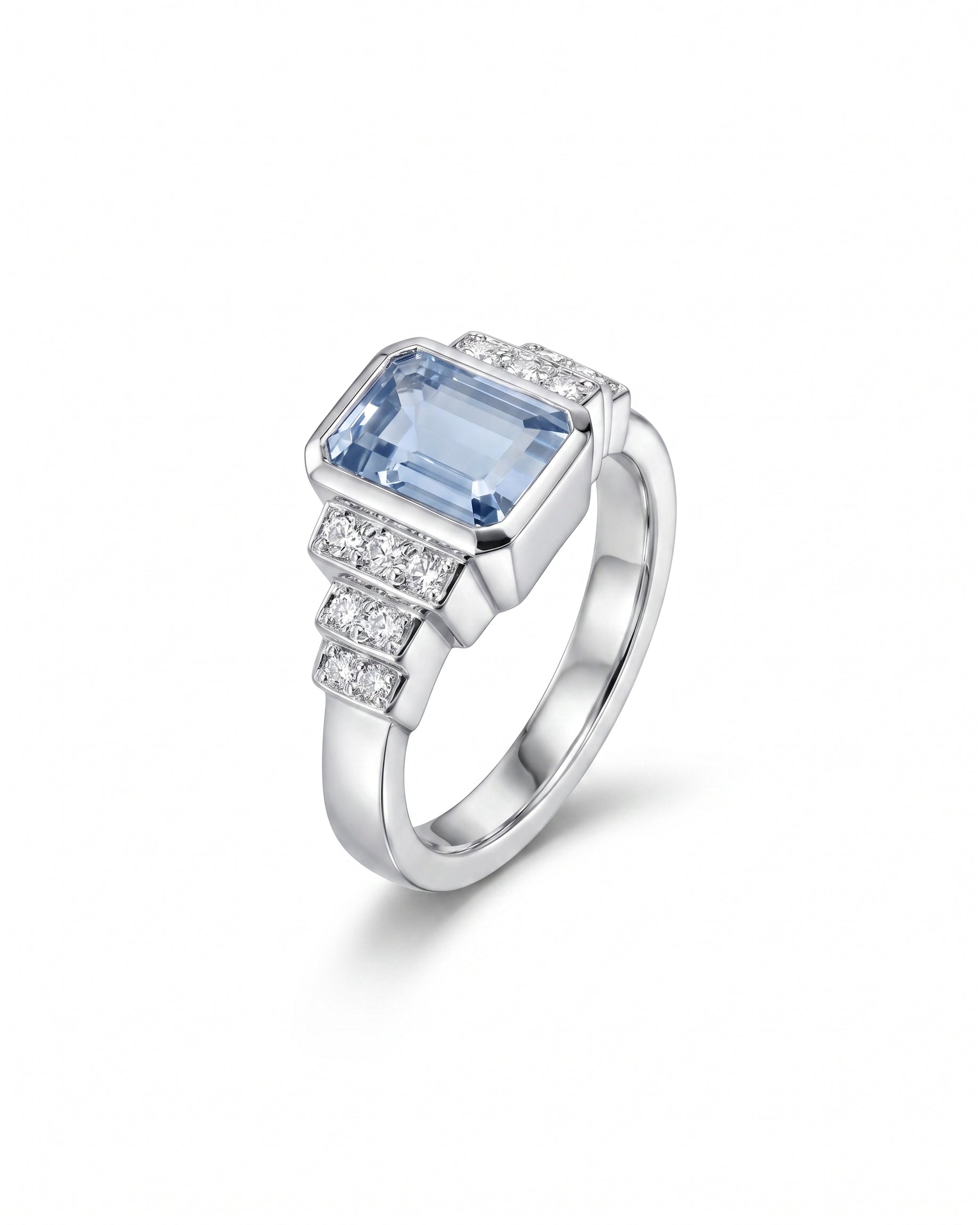 Art deco engagement ring featuring an emerald-cut aquamarine and diamond accents set in polished white gold.