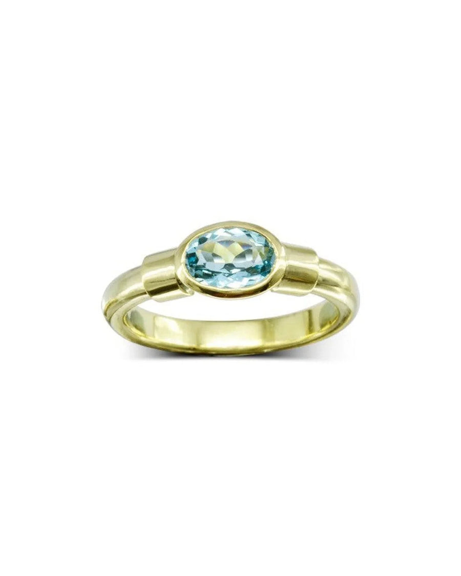 Gold ring with oval aquamarine gemstone, elegant handmade jewellery on white background