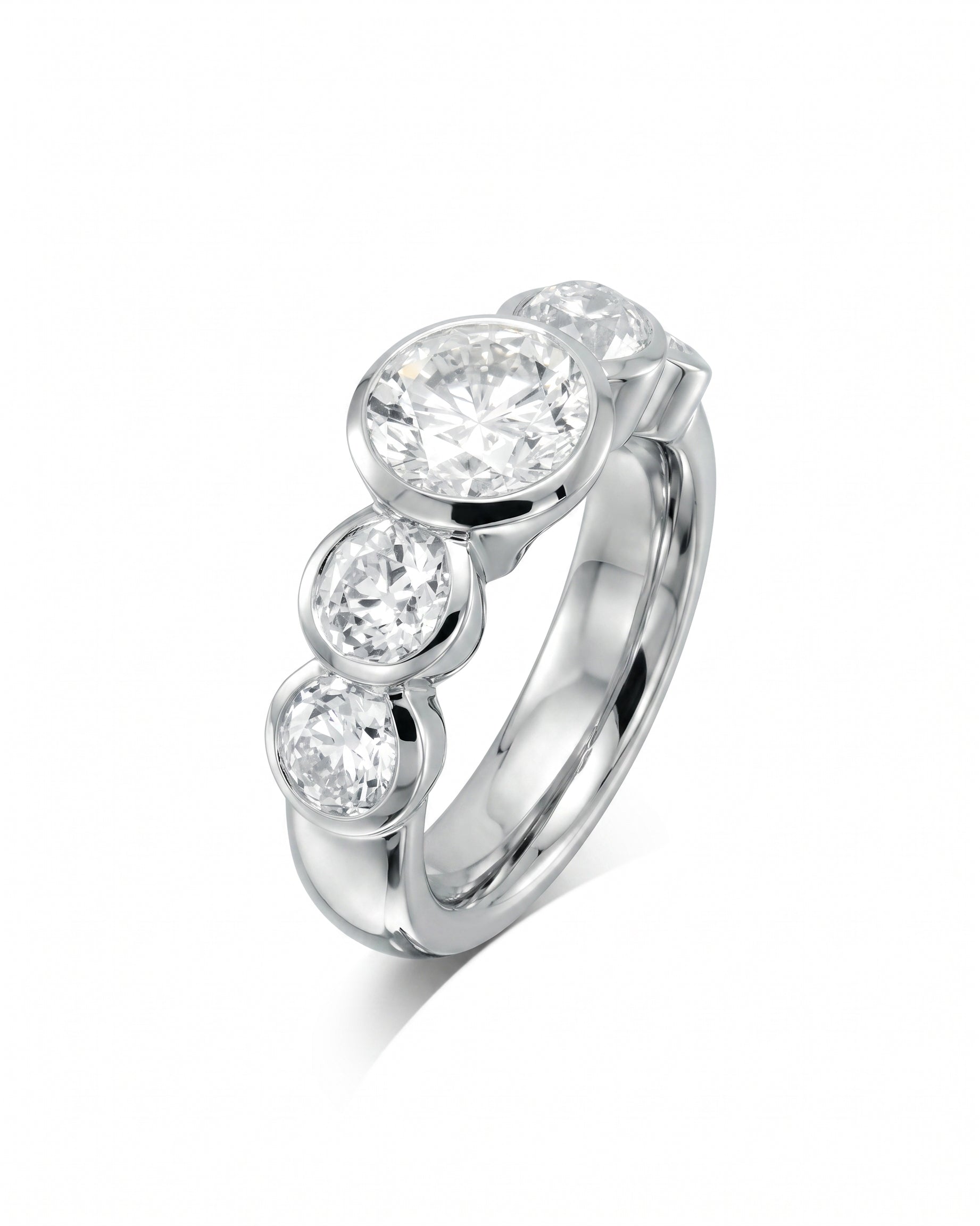 Platinum ring with five round brilliant cut diamonds.