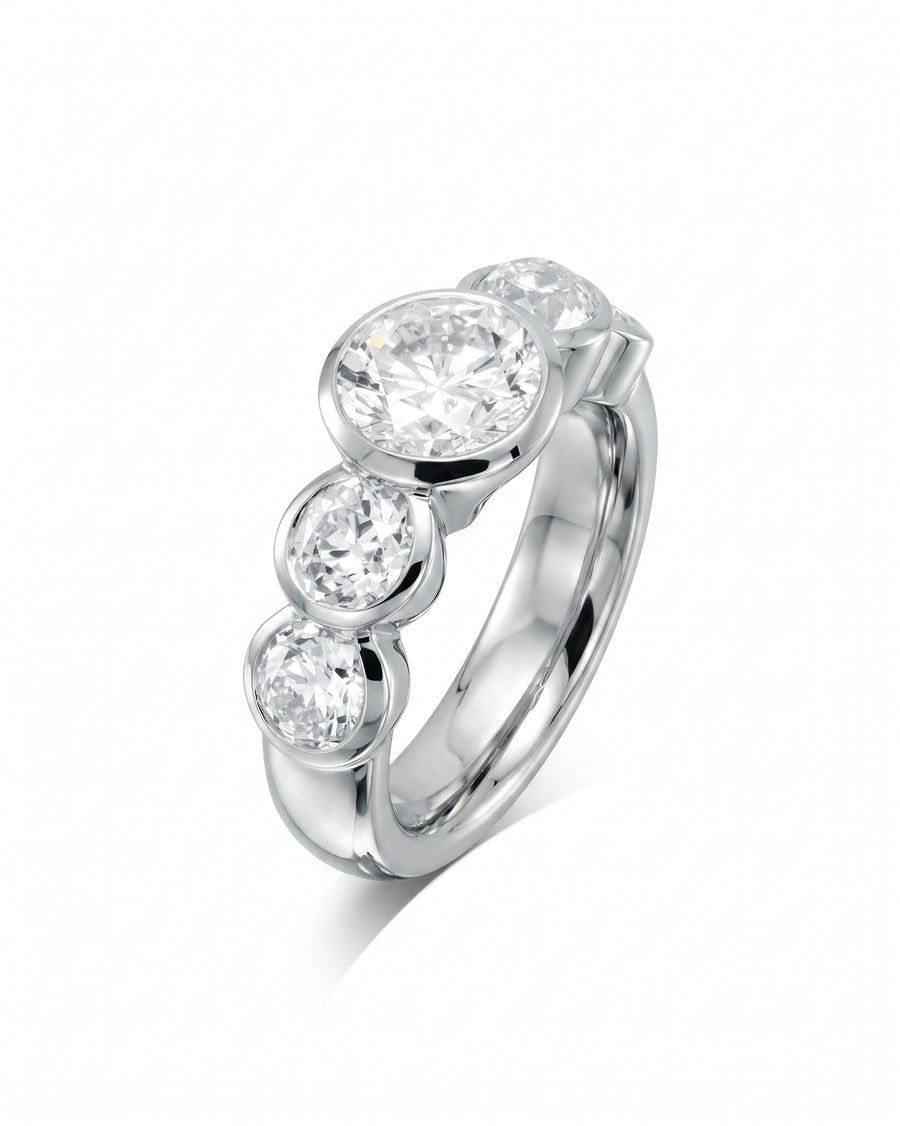 Platinum ring with four round brilliant cut diamonds.