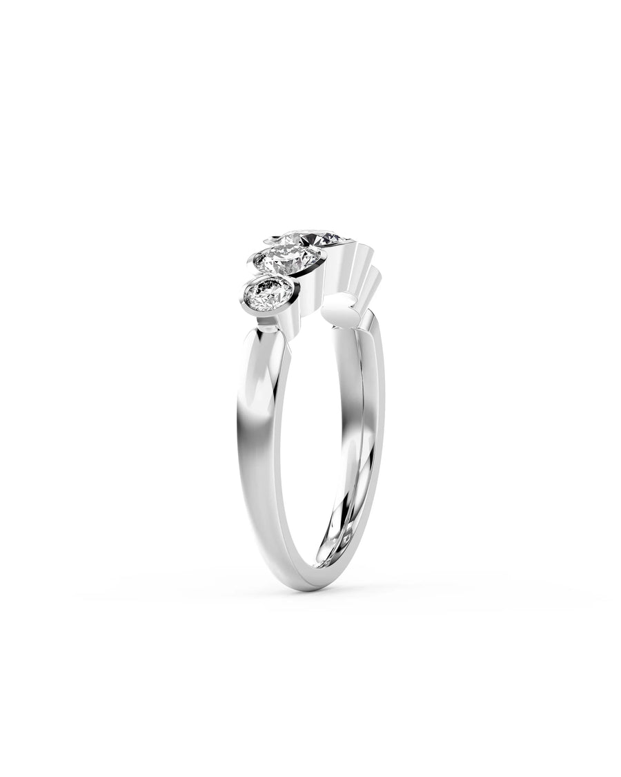 White gold engagement ring with five round brilliant cut diamonds.