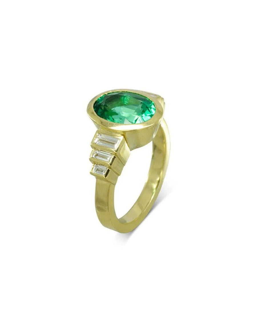 Art deco yellow gold ring with oval emerald and baguette diamonds