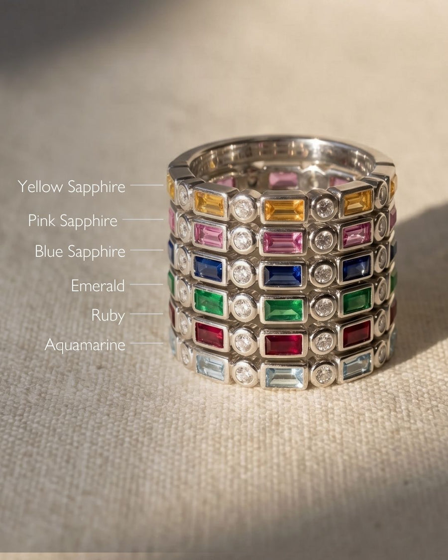 Silver baguette cut gemstone eternity rings with yellow, pink, blue sapphire, emerald, ruby, and aquamarine.