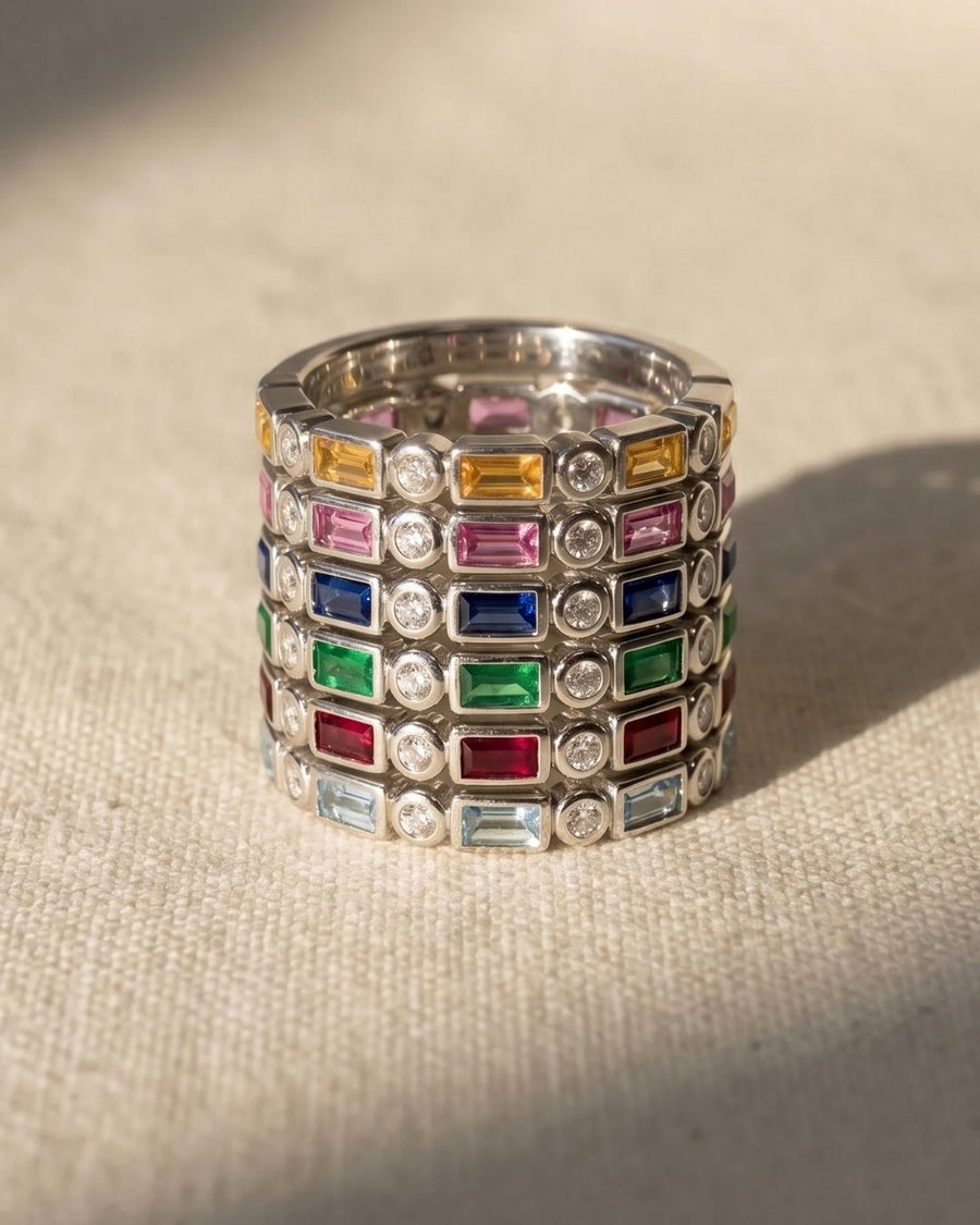 9ct white gold eternity rings with baguette cut aquamarine and other colorful gemstones.