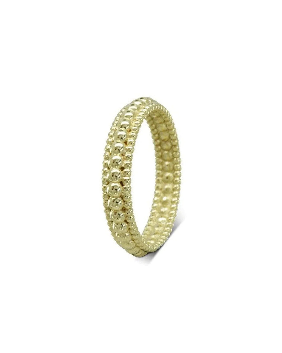 three row beaded yellow gold ring with textured design on white background