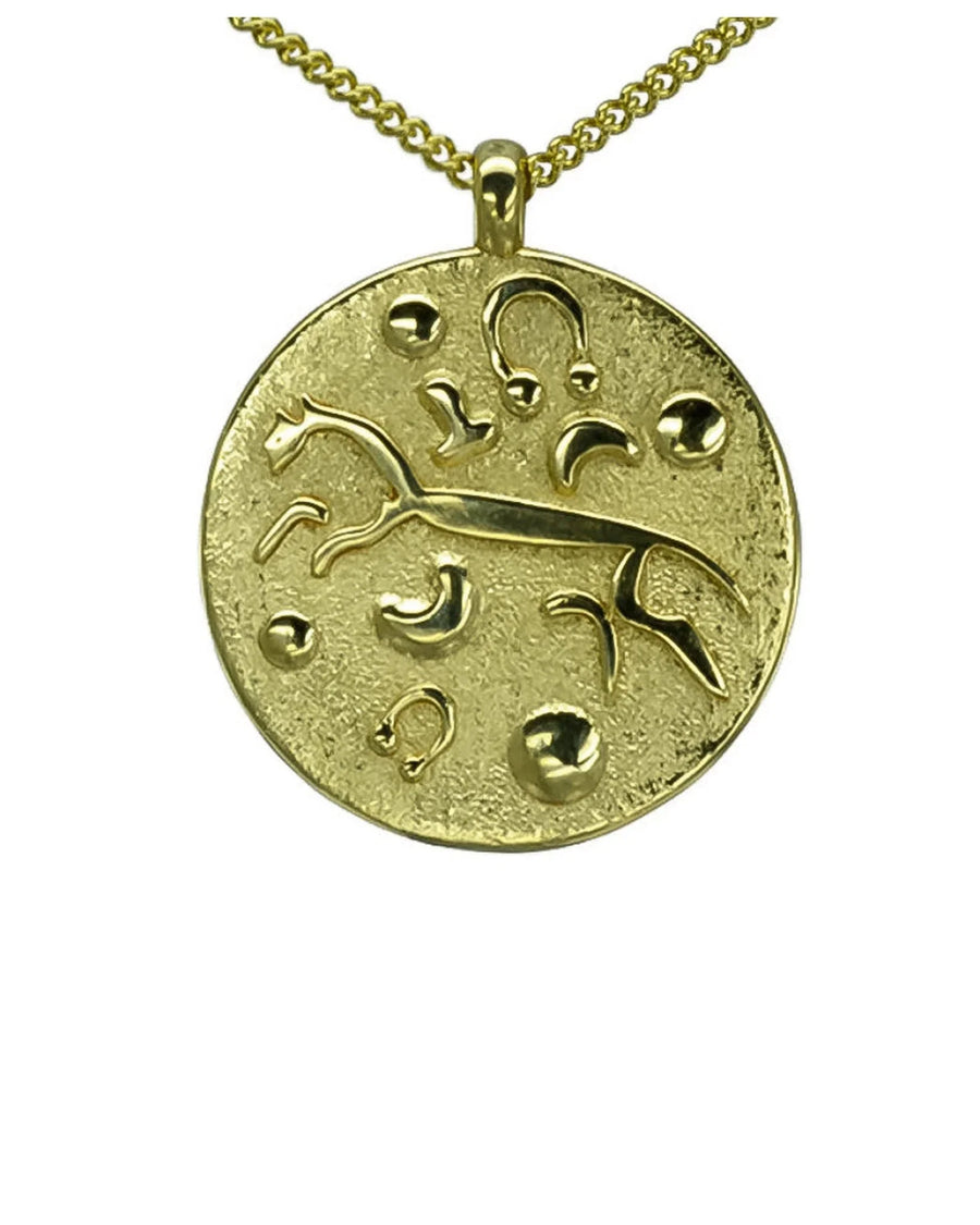 Gold pendant necklace featuring the White Horse of Uffington design on a textured disc