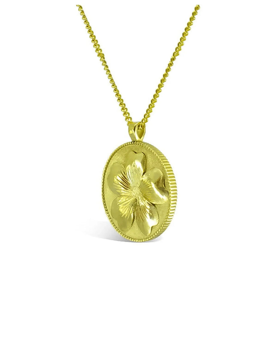 Solid gold coin pendant necklace with a raised primrose flower design