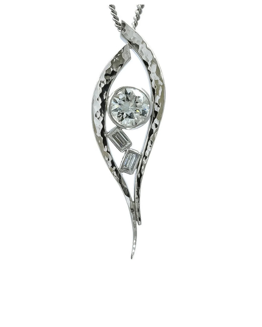 Handcrafted platinum pendant with organic hammered finish and three sparkling diamonds