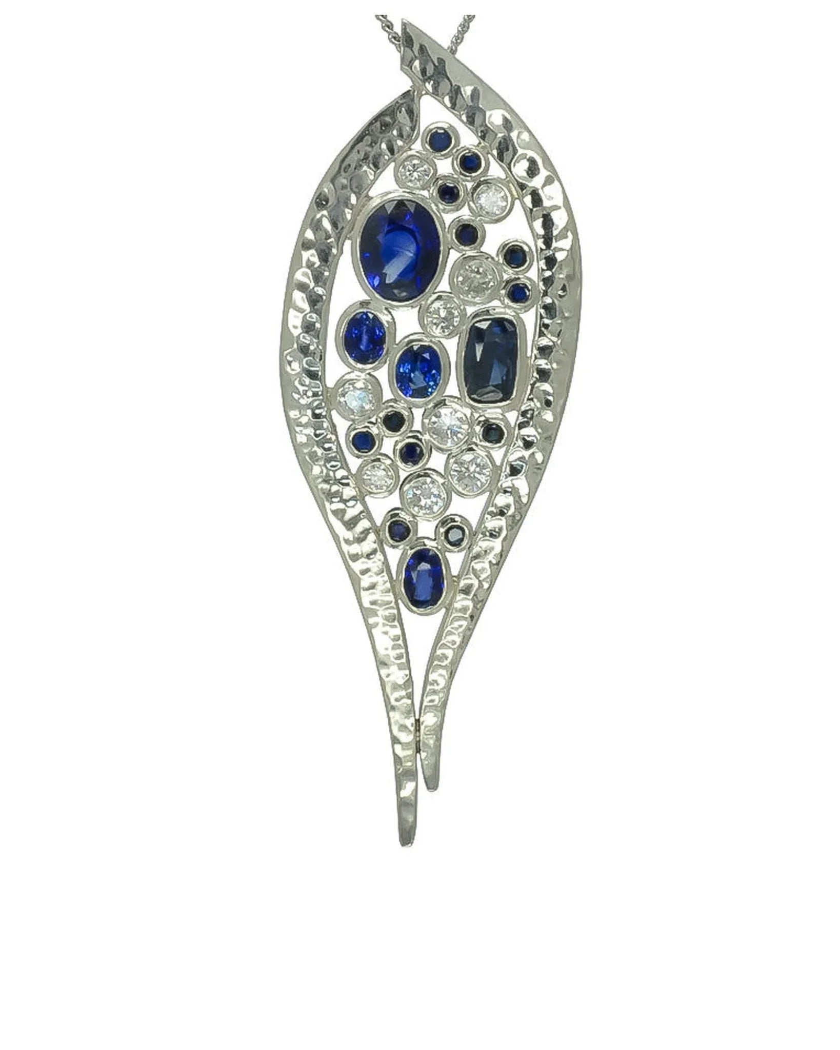 platinum pendant with blue sapphires and diamonds in textured leaf design
