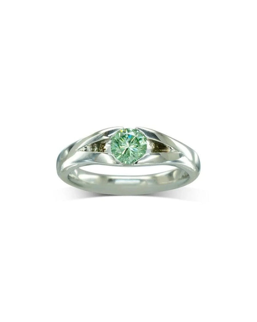 Platinum engagement ring with a round green diamond center stone.