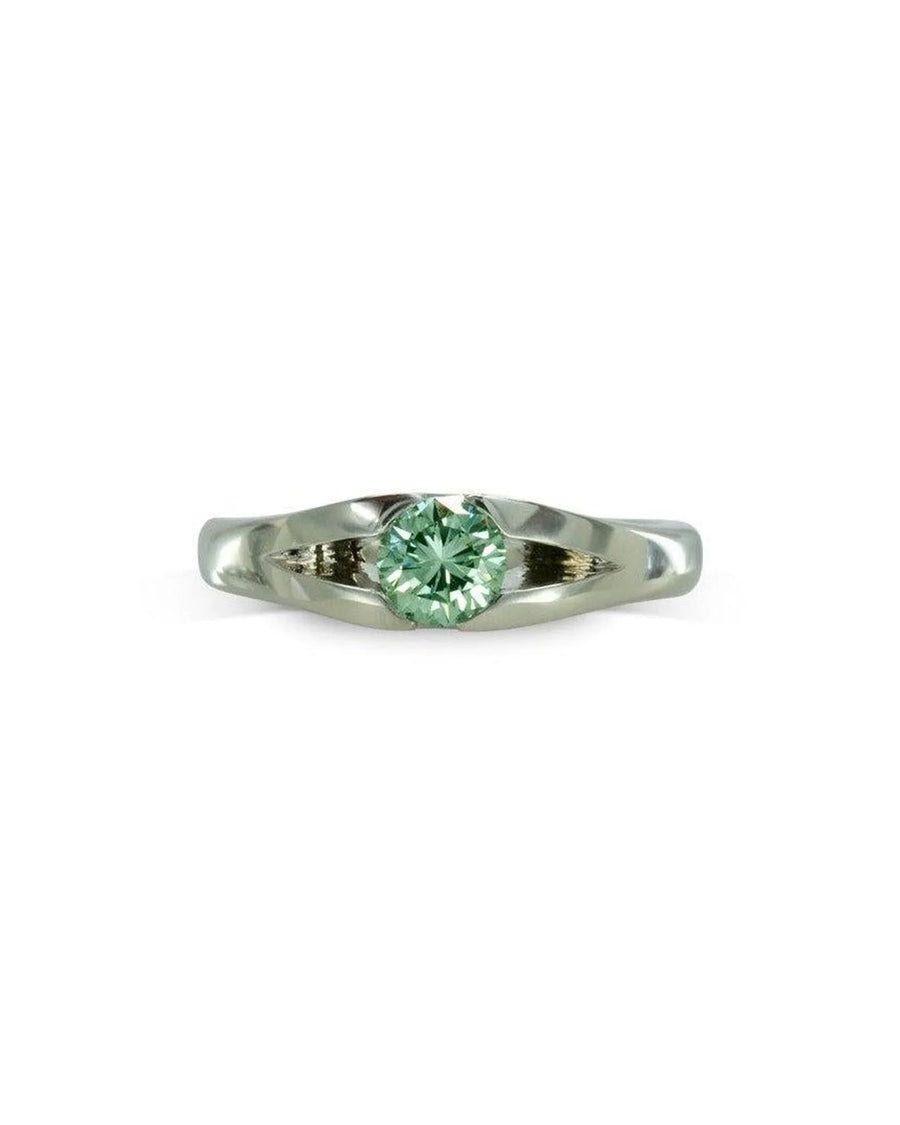 Platinum engagement ring with a round green diamond.