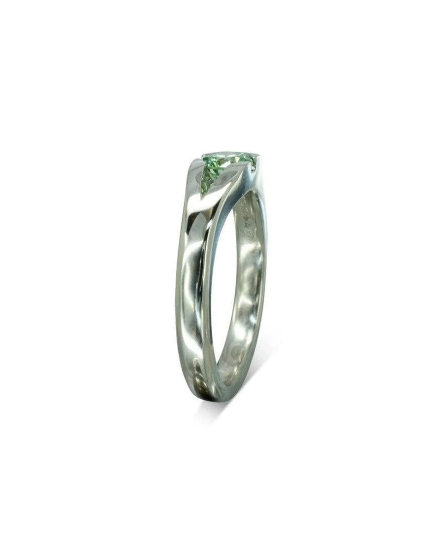 Platinum engagement ring with a bespoke green diamond.
