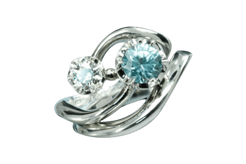 Bespoke ring design with a shooting star motif using platinum, diamond and aquamarine.